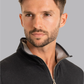 Close-up of Twillory men's charcoal performance quarter zip shirt showing fabric texture and zipper details.