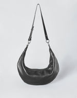 Black HYER GOODS Ring Bag hobo bag with silver hardware, featuring a rounded shape and adjustable shoulder strap.