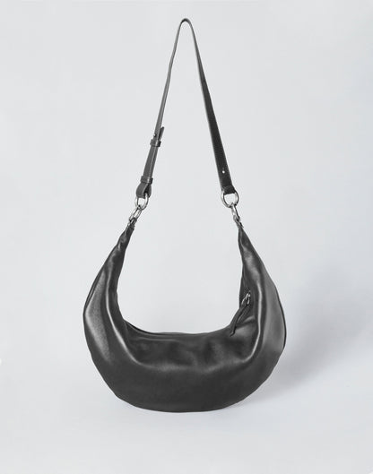 Black HYER GOODS Ring Bag hobo bag with silver hardware, featuring a rounded shape and adjustable shoulder strap.