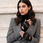 Black Rossana Italian lambskin leather fingerless driving gloves with a sleek, stylish design for driving and fashion.