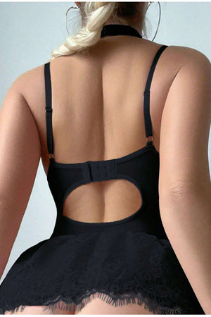 Black lace skirted babydoll set with sheer fabric, floral lace details, and adjustable straps, shown from the back.