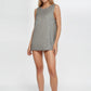 Trophy Yoga relaxed fit tank top, made in USA, shown in a simple studio view