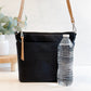 Carry Courage VISIONARY cross body bag in coal black, shown from the side with adjustable strap and zip closure