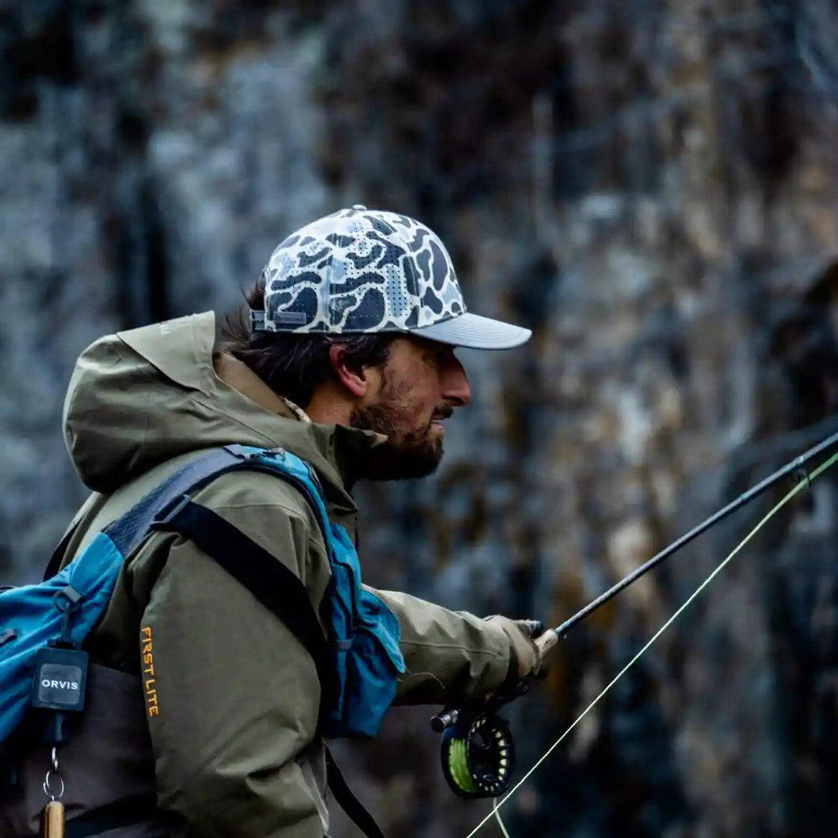 Terreno Hats Ridge Wetland Camo hat with woodland camouflage pattern, adjustable strap, and outdoor style.