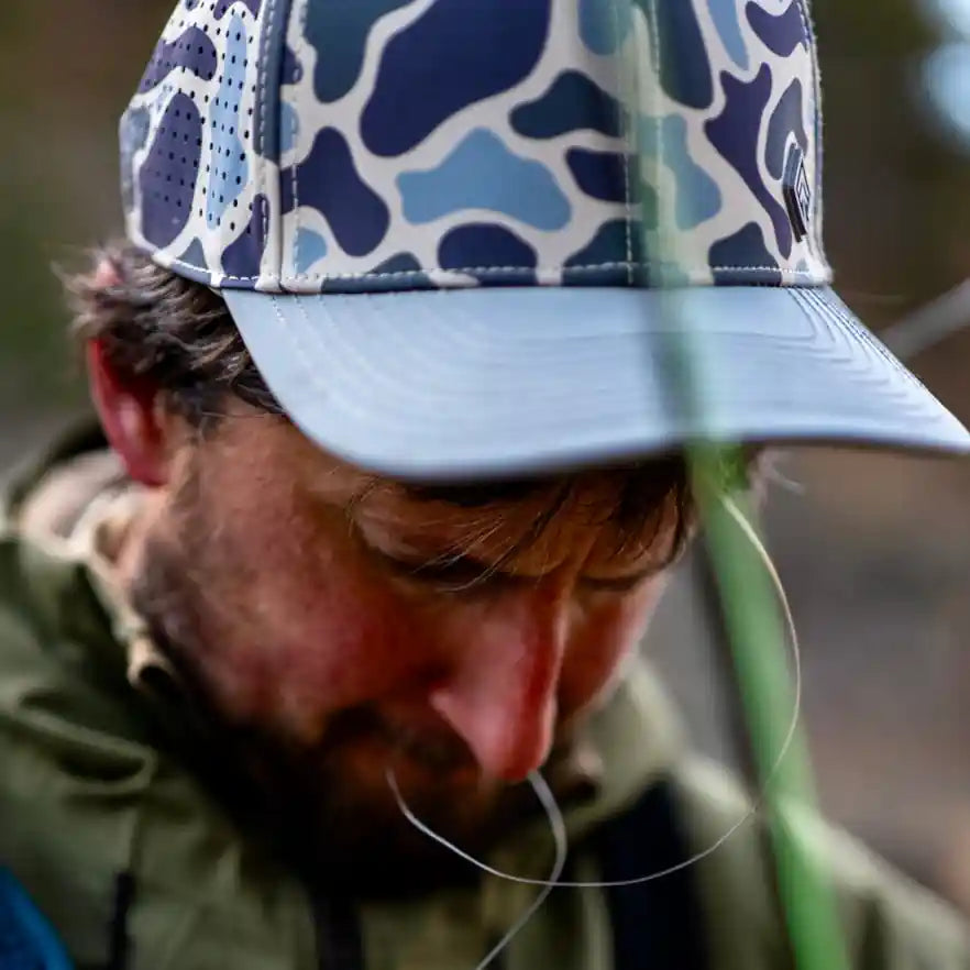 Terreno Hats Ridge Wetland Camo cap with adjustable strap and camouflage pattern, suitable for outdoor and casual wear