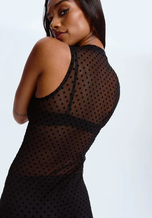 Lavinia Blush Enigma sheer mesh polka dot fitted dress with long sleeves and elegant silhouette, shown on a model.