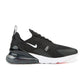 Nike men's Air Max 270 footwear in black and white, side view