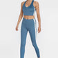 Trophy Yoga side split crop top in blue, featuring four-way stretch fabric and a relaxed fit