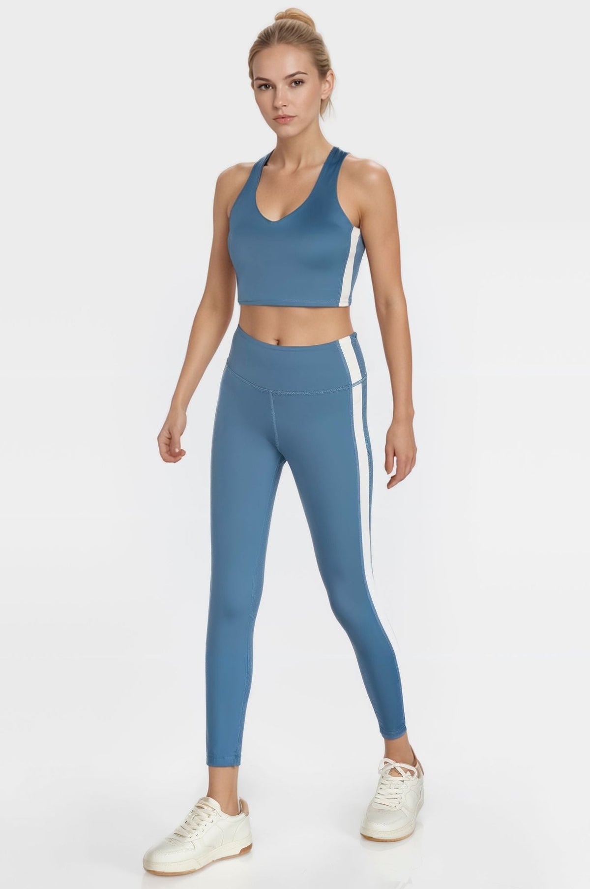 Trophy Yoga side split crop top in blue, featuring four-way stretch fabric and a relaxed fit
