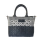 Black small woven crossbody bag by Tin Marin Brand, featuring a compact design with woven texture and adjustable strap.