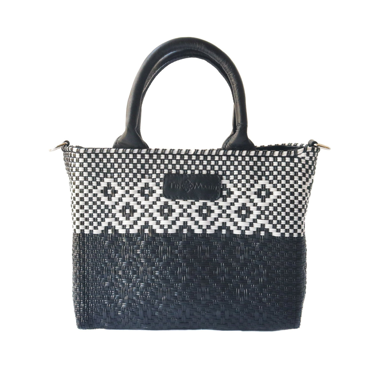Black small woven crossbody bag by Tin Marin Brand, featuring a compact design with woven texture and adjustable strap.