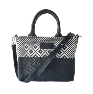 Black small woven crossbody bag by Tin Marin Brand, featuring textured fabric and a compact design for everyday use.