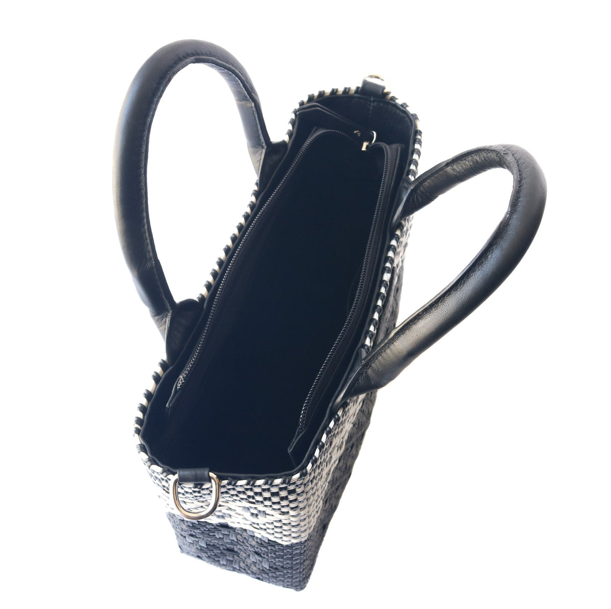 Black small woven crossbody bag by Tin Marin Brand, featuring a compact design with woven texture and adjustable strap.