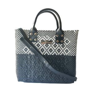 Large black woven crossbody bag by Tin Marin Brand with leather accents, featuring a spacious design and adjustable strap.