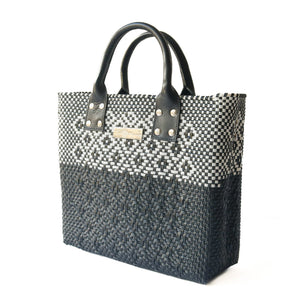 Large black woven crossbody bag by Tin Marin Brand, featuring black leather accents and a spacious design for everyday use.