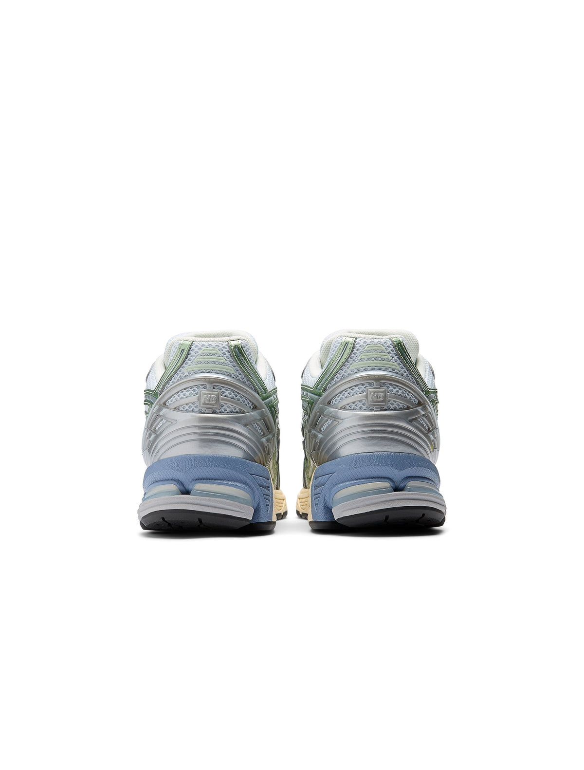 New Balance women's 1906 sneakers in metallic green, stylish athletic footwear with a sleek design and textured details.