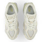 New Balance men's 9060 lifestyle shoes in white and yellow with sporty design and cushioned sole.