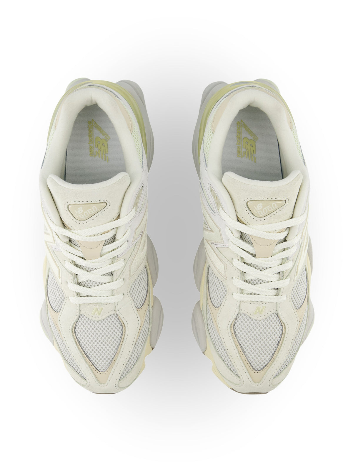 New Balance men's 9060 lifestyle shoes in white and yellow with sporty design and cushioned sole.
