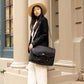 Carry Courage NOMAD messenger bag in coal gray, showing its structured design and adjustable shoulder strap