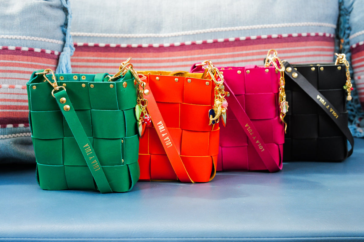 Mini Tula Green bag by LOLA Y TULA featuring a compact, stylish design with green fabric and adjustable strap.