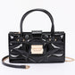 Embossed Enamel Handle Clutch - Farnelli