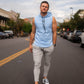 Ice blue Alyth Active DETERMINED hooded sleeveless clothing front view, showcasing sporty design and sleeveless style.