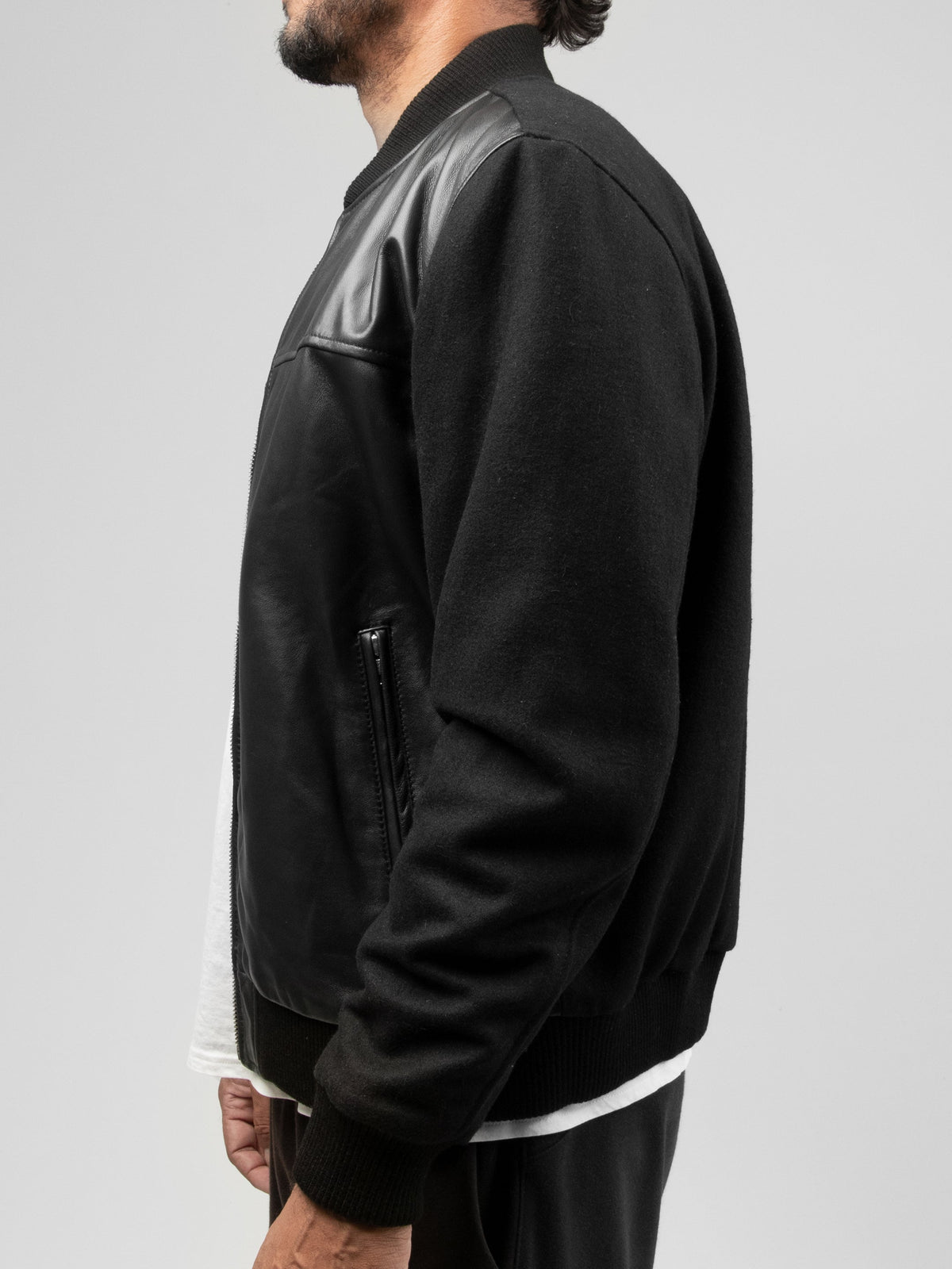 Side view of Whet Blu NYC Andre men's varsity leather jacket