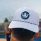 ARTI white performance crown rope hat with structured crown and curved brim in lifestyle setting