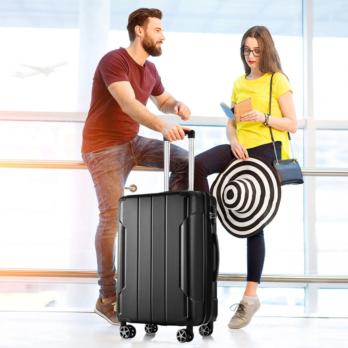 HouseOfZazla 24-inch black hardshell ABS suitcase with expandable design and double wheels