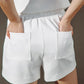 White Flying Tomato Call My Lovely Shorts with a relaxed fit and casual style, perfect for summer wear.