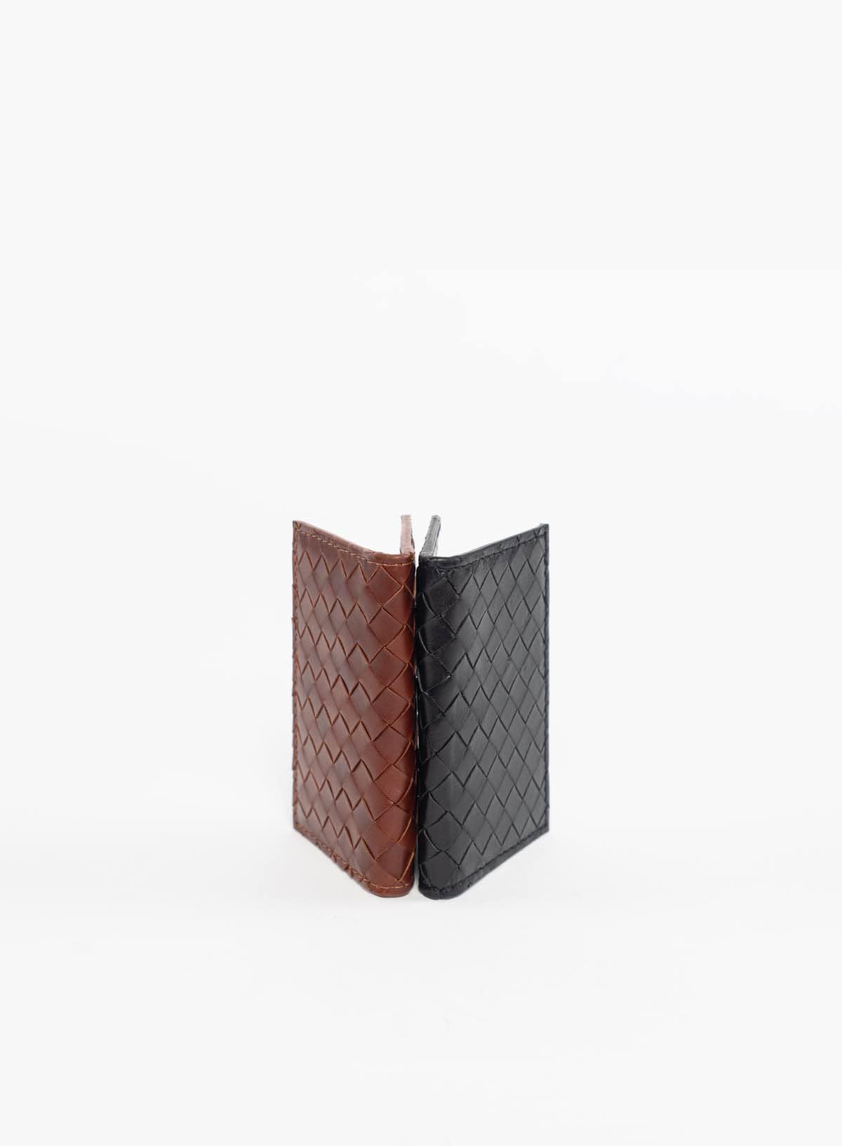 Deux Mains Woven Card Holder in black and tan, shown from side views
