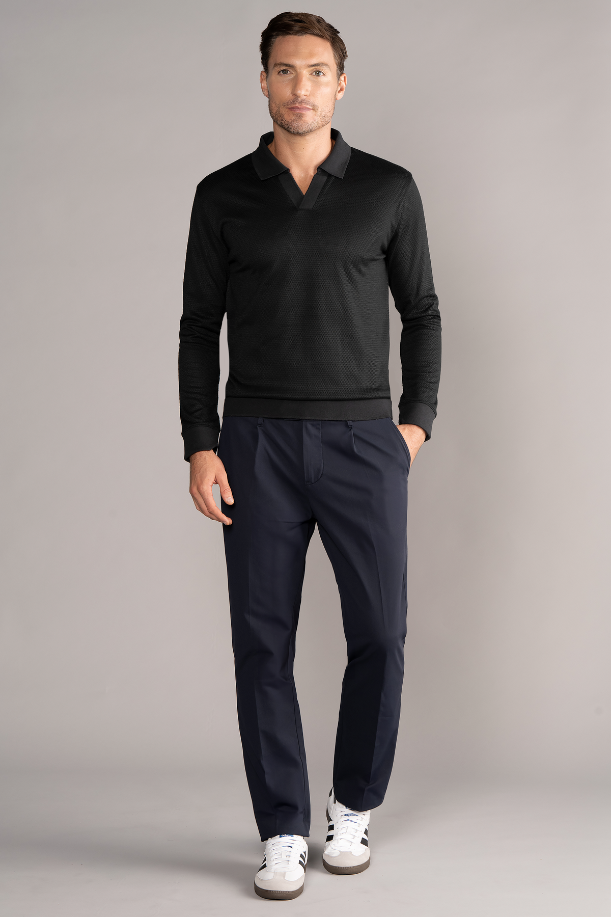 Black Twillory long sleeve sweater polo with solid design, featuring a classic collar and button placket.