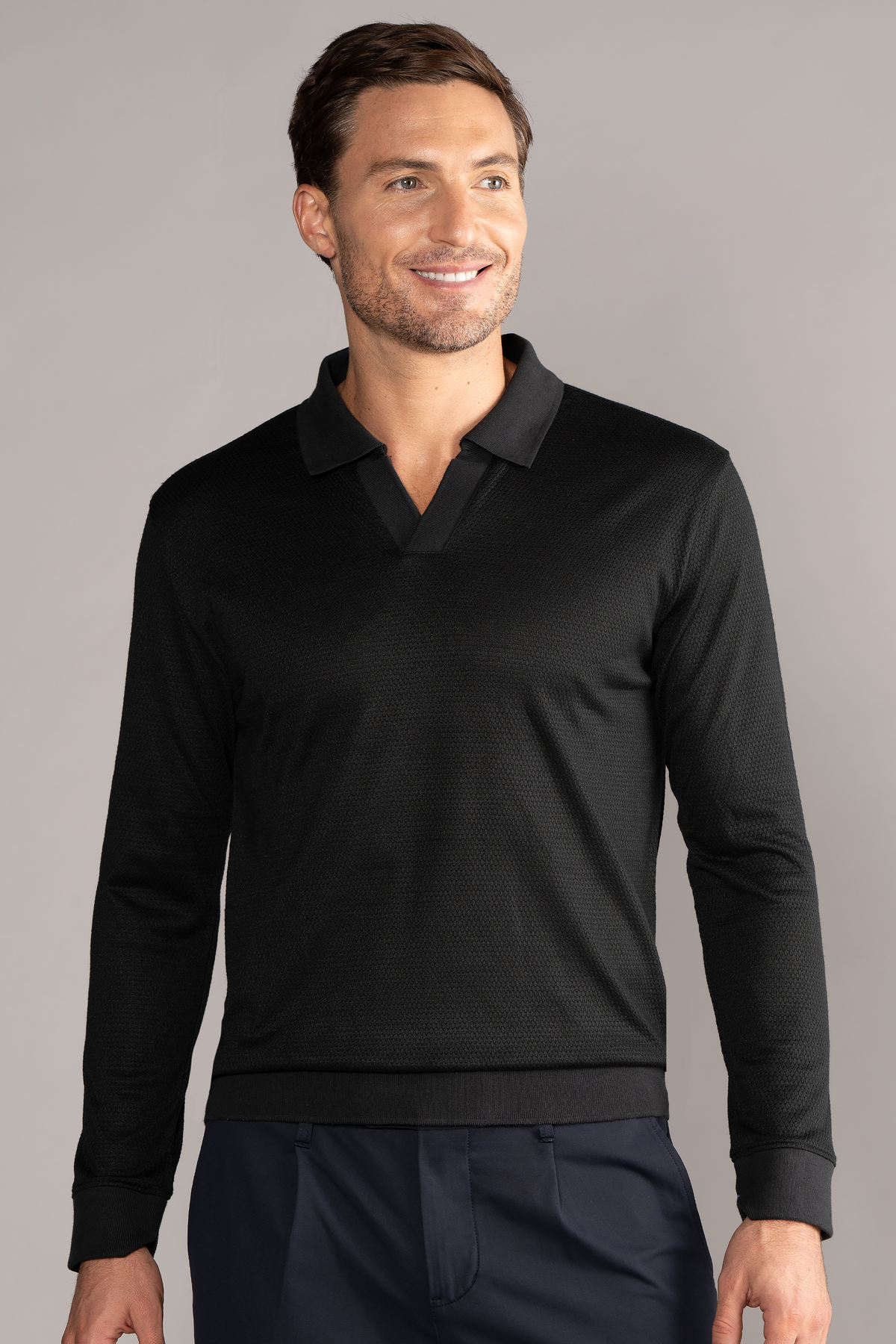 Black long sleeve sweater polo by Twillory, showcasing a classic fit and solid color design.