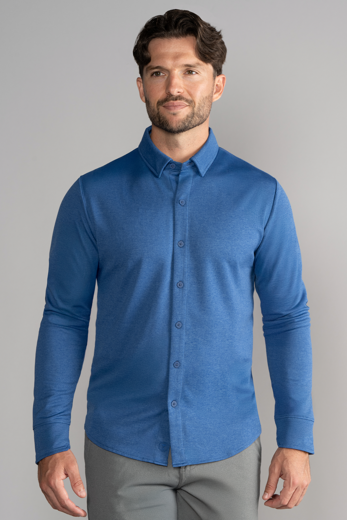 Blue long sleeve button-down polo shirt by Twillory, solid color with a classic collar and button placket.