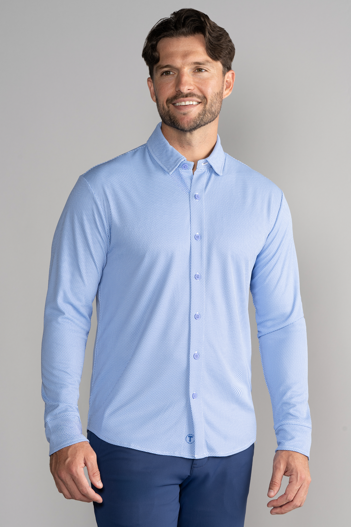 Blue long sleeve button-down polo shirt with a dotted pattern from Twillory's AthlPoloBDLongSolid collection.