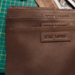 Deux Mains brown leather middle size tote bag with shoulder straps and detailed stitching