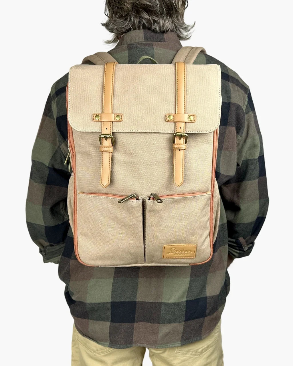 Baldwin Baby Company Bon Secour canvas diaper backpack, front view modeled with adjustable shoulder straps