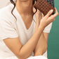 Deux Mains woven card holder in a compact wallet design from the spring collection
