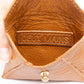 Deux Mains cognac leather coin pouch interior view with main compartment and card slots