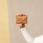 Deux Mains cognac leather coin pouch, front view