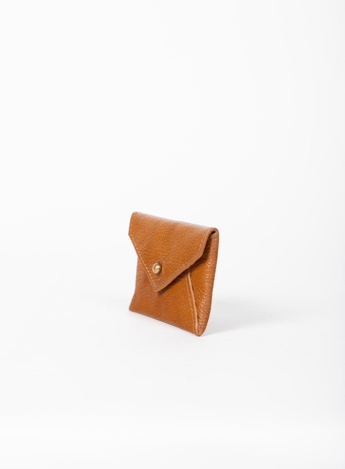 Deux Mains cognac leather coin pouch, side view