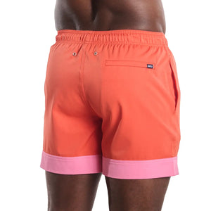 Coral Flame hybrid swim trunks by Capelle Miami with compression lining, solid color, back view, perfect for resort and beach wear.