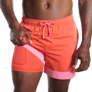 Coral Flame hybrid swim trunk with compression lining from Capelle Miami, featuring solid coral color and stylish resort design.