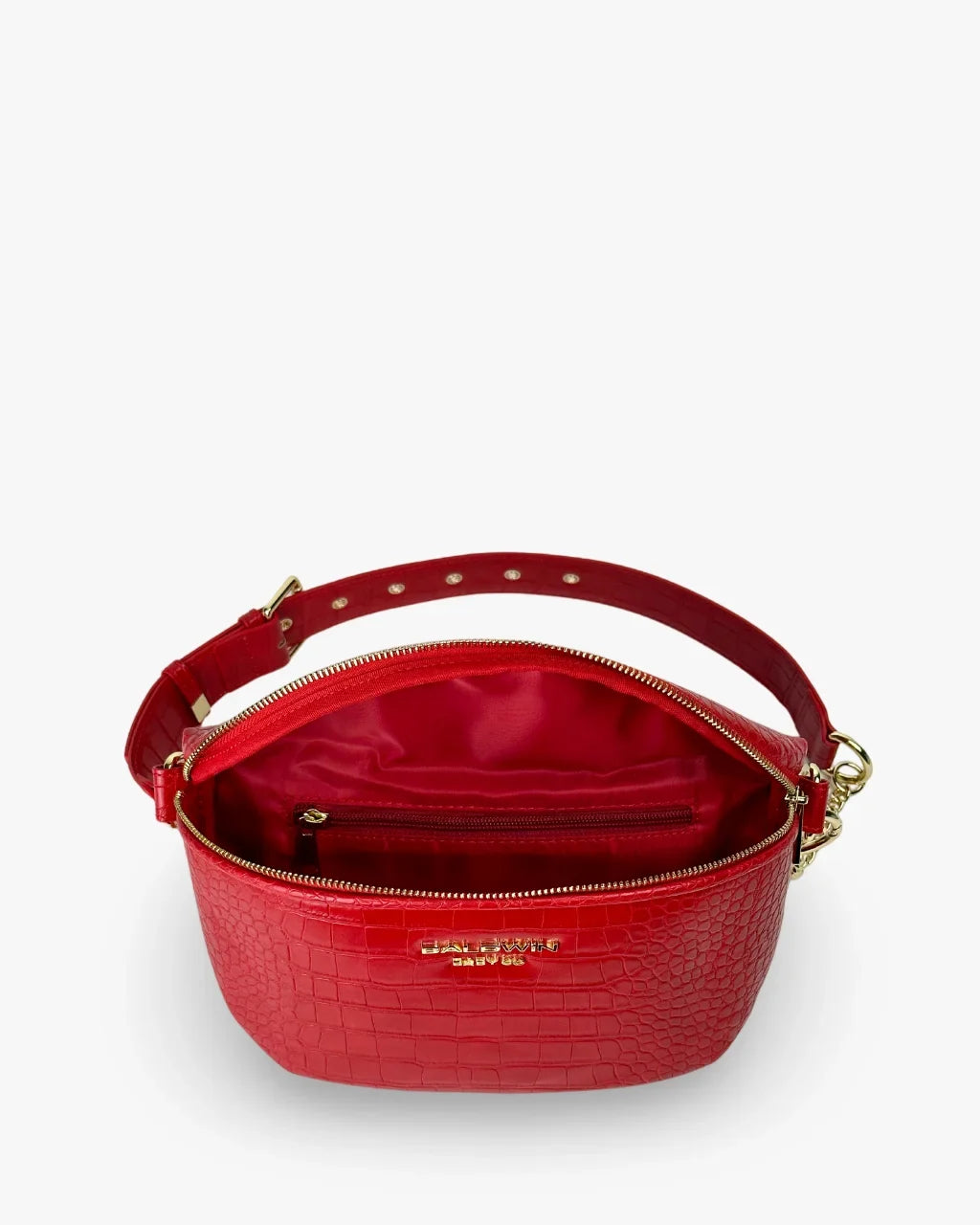 Baldwin Baby Company Ono Crossbody Belt Bag in cardinal red, showing the spacious interior compartments