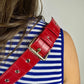 Baldwin Baby Company Ono Cardinal red crossbody belt bag diaper bag worn as a shoulder bag