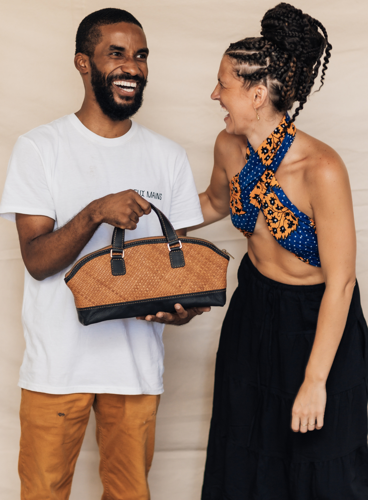 Deux Mains East-West handbag in an artisan-crafted design, shown against a plain background