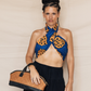 Deux Mains East-West handbag close-up showing its structured shape and detailed craftsmanship