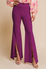 Flying Tomato Hey Darling woven flare pants with a high waist and vibrant pattern, displayed on a mannequin.