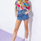 Flying Tomato Sunny Romance denim skort shorts with a stylish design, shown in a medium size on a model.