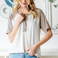 Heimish Full Size Animal Print Half Button Short Sleeve Top - Farnelli